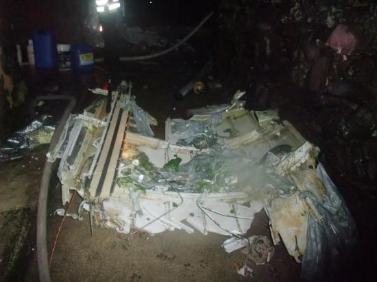 疑迫降失敗墜毀。圖為失事飛機(jī)殘骸。